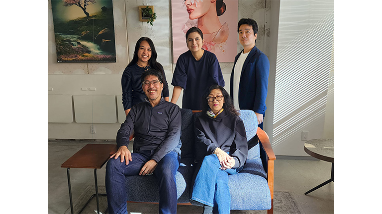 The NewNorm Design team (Back row center: CEO Fara Taraie)